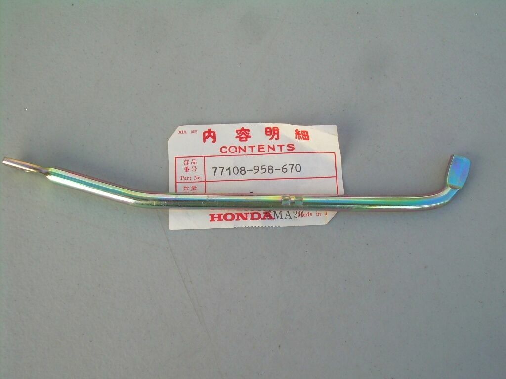 77108-958-670 NOS Honda seat lock lever fits 1981-83 ATC185