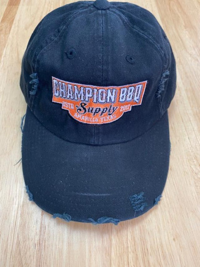 Black and Orange Champion BBQ Supply Logo Non-Structured Distressed Hat