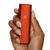 Poppy color Pax Mini size comparison in hand