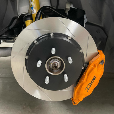 Paragon 2-piece rear brake rotors (350mm x 28mm) installed on a Dodge Challenger SRT Hellcat, showcasing slotted design and aerospace-grade aluminum hats. Paragon 2-piece rear brake rotors (350mm x 28mm) installed on a Dodge Challenger SRT Hellcat, showcasing slotted design and aerospace-grade aluminum hats.
