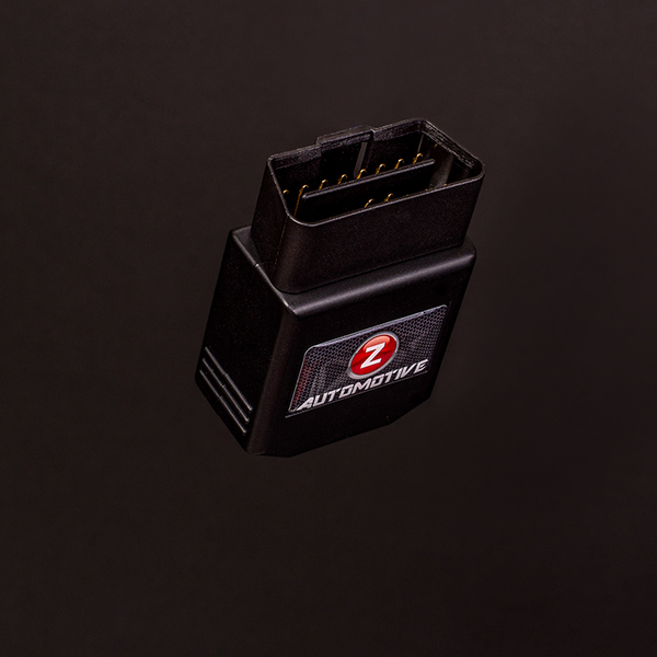 Z Automotive Tazer plugged into OBD2 port, enabling Track Mode and line lock on a Dodge Challenger