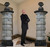 Two cardboard cutout columns for entryway decorations with easel on back