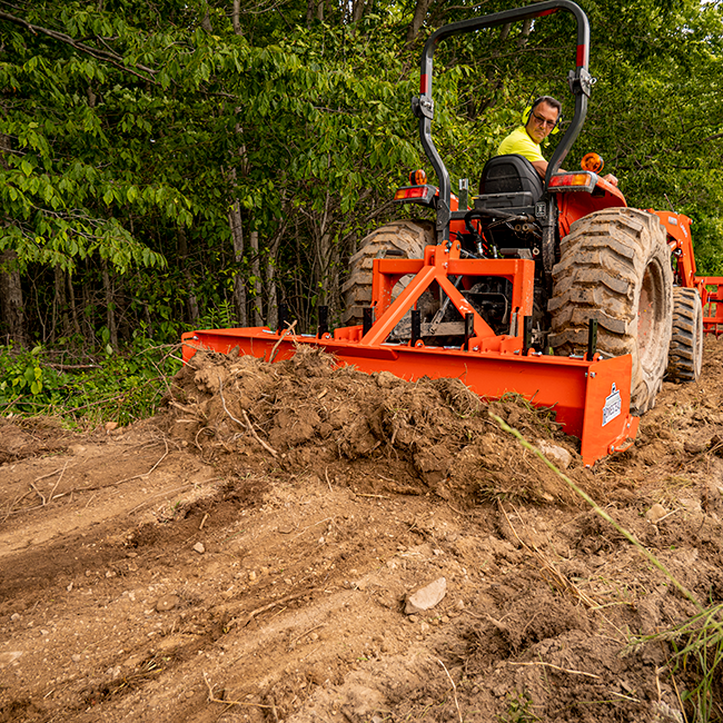 Pinnacle Series Box Blade pulling and regrading dirt pile.