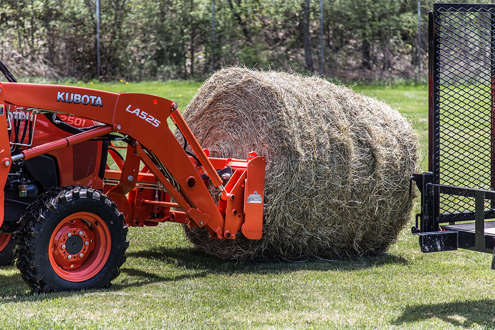 Front-End Independence Bale Spear picks up round bale from ground. 