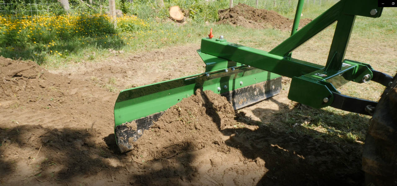 Pinnacle Series Back Blade Green, moving dirt pile.