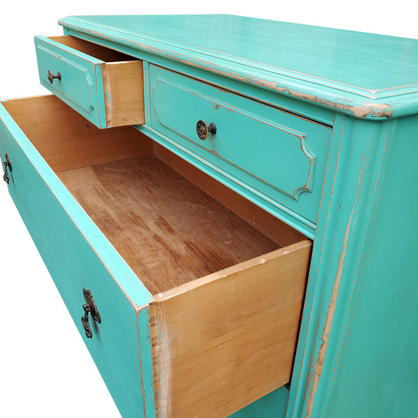 Aqua dresser with drawers open.