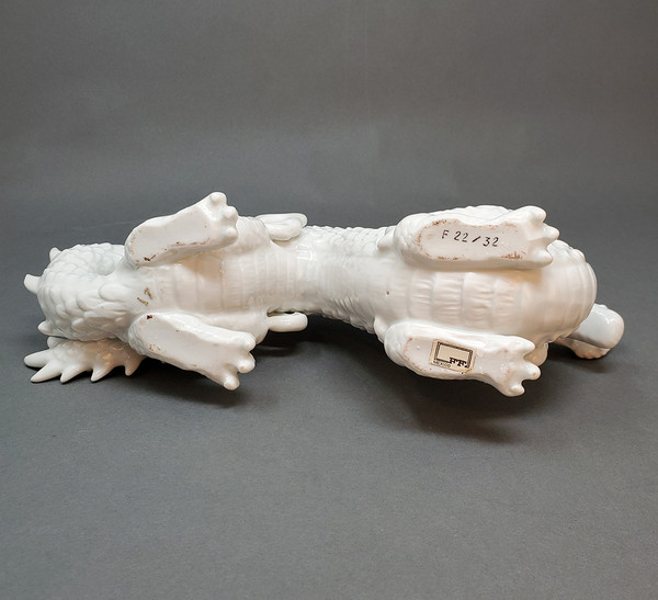 Bottom of porcelain dragon figurine.