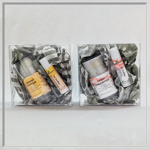 2026 Happy Elf Gift Sets include our luscious Lip Butter and our decadent Cocoa Butter Push-Up Moisturizer — available in either Sweet Peppermint or Sweet Citrus
