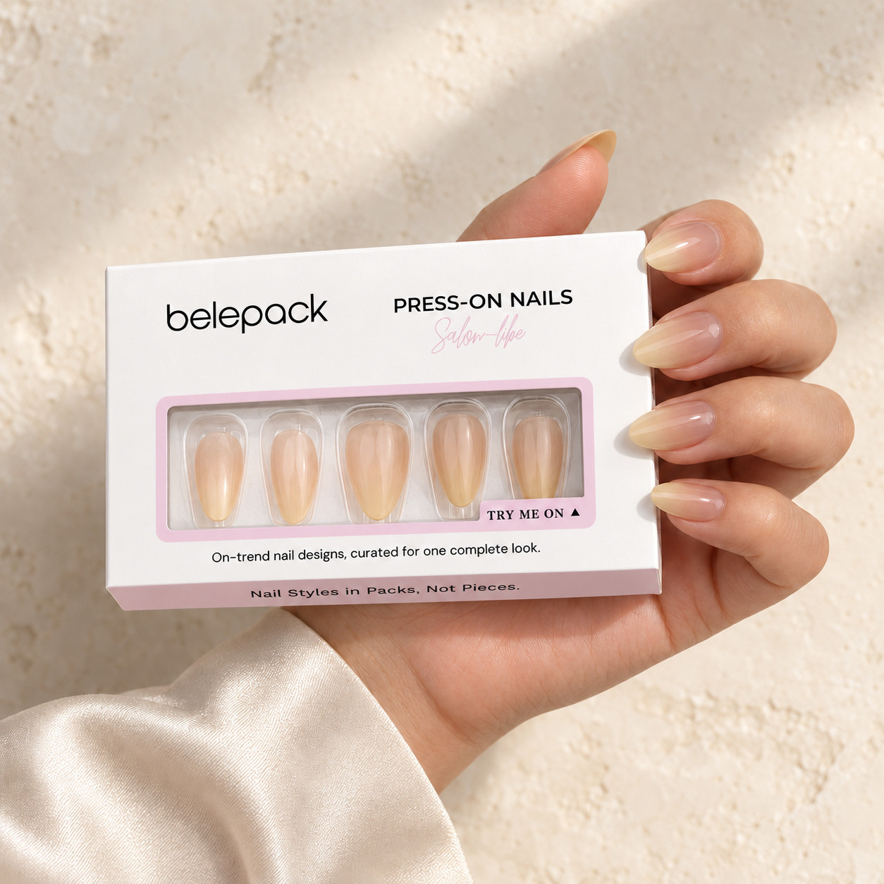 BP003 retail box held beside matching pink and white ombre nails