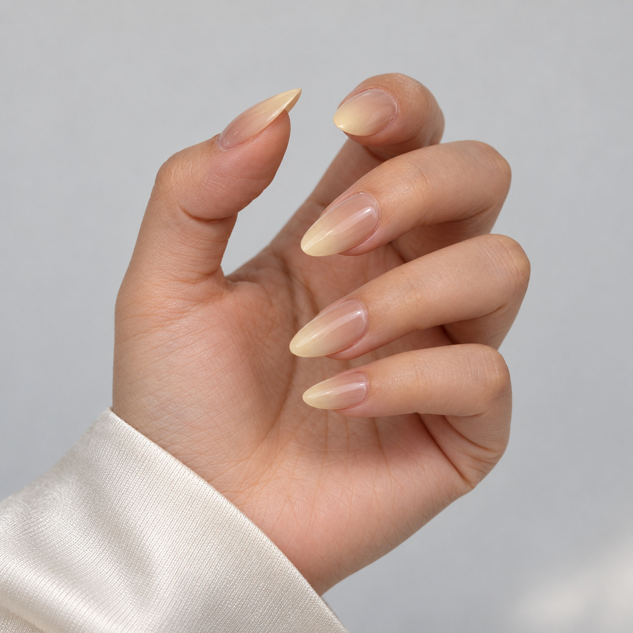 BP003 pink and white ombre short almond nails shown from a side angle