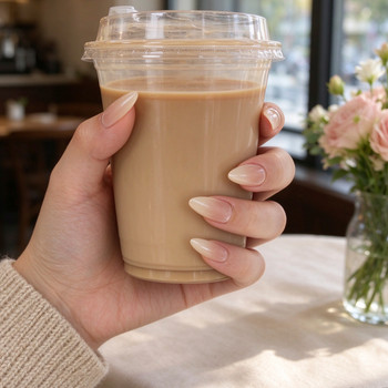 BP003 pink and white ombre short almond nails worn on a hand