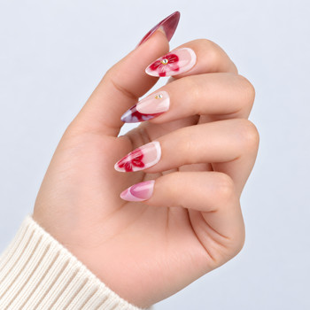 Side view of the burgundy tips and floral almond nail designs