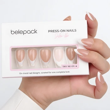 Nude French tip nails and Belepack box in a hand-held view