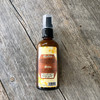 super spray back, bottle on wooden background