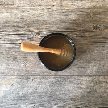 Pomegranate Kiss Salt Scrub top view showing texture with a spoon