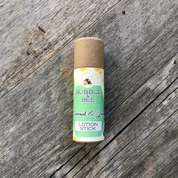 Main view of lotion stick. Cardboard tube with green and yellow label