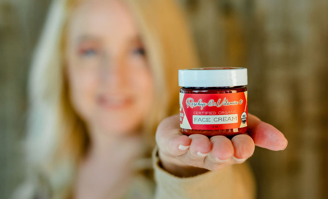 photo of stephanie holding face cream