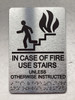 NYC IN CASE OF FIRE USE STAIRS UNLESS OTHERWISE INSTRUCTED SIGN WITH RAISED LETTERS SIGN