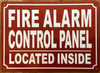 FIRE ALARM CONTROL PANEL LOCATED INSIDE SAFETY SIGN