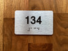 Apartment number 134 Compliance Sign