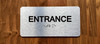 Entrance With Sign with Raised Letters Compliance Sign