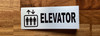 elevator-hallway-silver-safety-sign.jpg