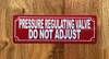 red-pressure-regulating-valve-do-not-adjust-screw-mount-sign.jpg