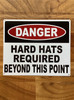 danger-hard-hat-required-behind-this-point-white-safety-sign.jpg