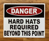 danger-hard-hat-required-behind-this-point-aluminum-identification-sign.jpg