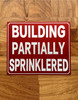building-partially-sprinklered-sign-red-equipment-notice.jpg