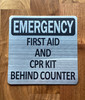 silver-emergency-first-aid-cpr-kit-behing-counter-building-notice.jpg