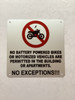 No battery powered bikes or motorized vehicles are permitted in the building or apartments Safety Sign