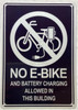 NO BATTERY BIKES OR MOTORIZED VEHICLES ARE ALLOWED IN THIS BUILDING AT ALL TIMES DOB SIGN