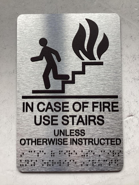 NYC IN CASE OF FIRE USE STAIRS UNLESS OTHERWISE INSTRUCTED SIGN WITH RAISED LETTERS SIGN