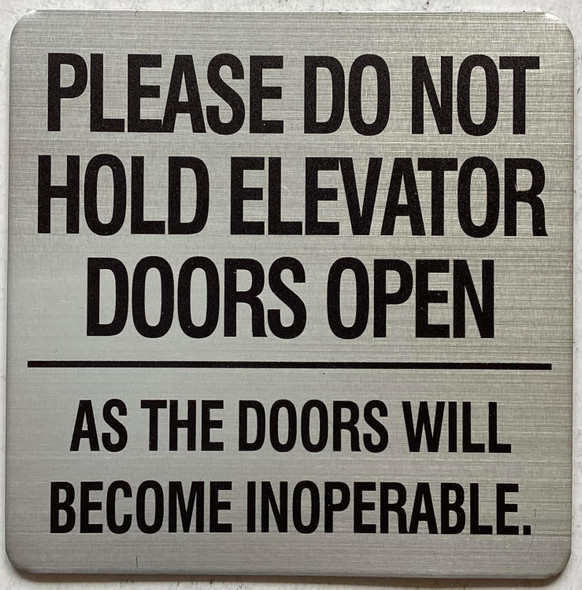 Please do not hold elevator doors open as the doors will become inoperable sign Please do not hold elevator doors open as the doors will become inoperable sign