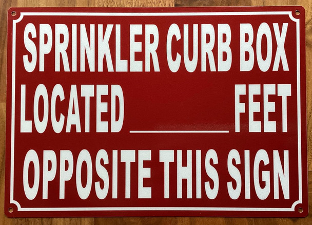 SPRINKLER CURB BOX LOCATED FEET OPPOSITE THIS SIGN SIGN