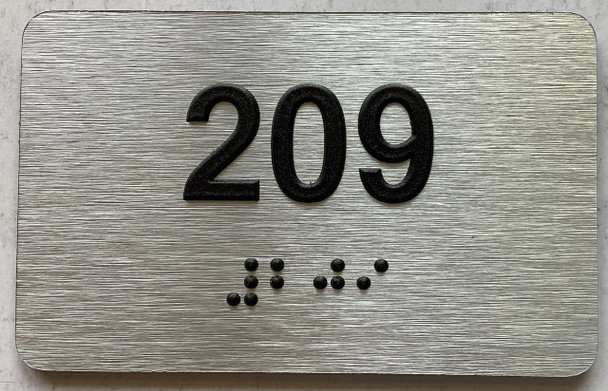 ADA APARTMENT NUMBER 209 SIGN