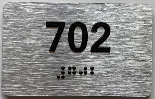ADA APARTMENT NUMBER 702 SIGN