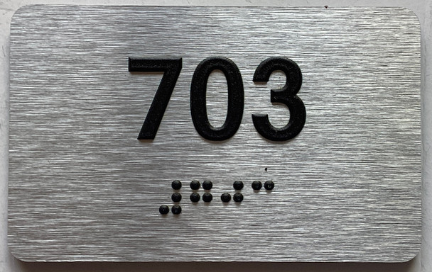 ADA APARTMENT NUMBER 703 SIGN