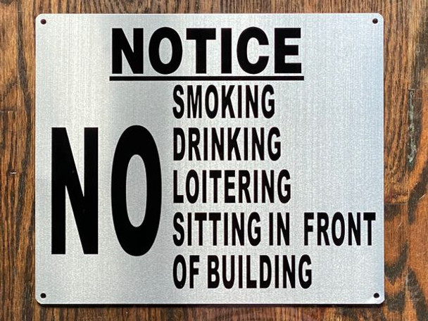 NO SMOKING DRINKING LOITERING SITTING IN FRONT OF BUILDING SIGN NO SMOKING DRINKING LOITERING SITTING IN FRONT OF BUILDING SIGN