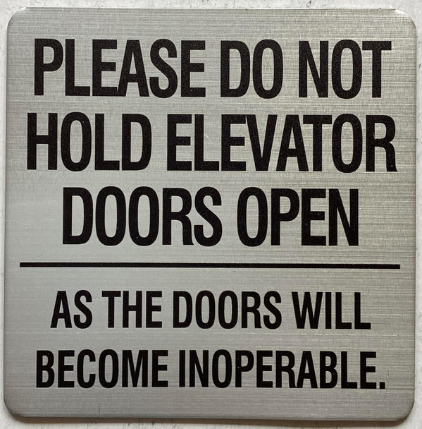 Please do not hold elevator doors open as the doors will become inoperable sign Please do not hold elevator doors open as the doors will become inoperable sign