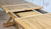 Angled overhead view showcasing the extension mechanism of the Harrington Table at mid-extension