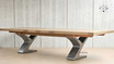 Quinn Table: A blend of sophistication and functionality, with its sleek design and extendable feature.