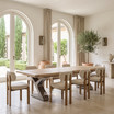 Quinn extendable dining table with light timber top and sculptural metal base, paired with upholstered timber dining chairs.