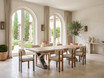 Quinn double extendable dining table with natural timber top and metal base, styled with eight dining chairs in a light Mediterranean interior.