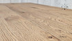 The Trailbridge Canyon Table’s surface under natural light, accentuating the natural beauty of the oak