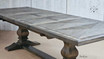 Angled detail of the table top, focusing on the stunning handcrafted parquetry inlay and pedestal table base