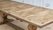 Zoomed-in view of the table’s pedestal base, focusing on the carved details and robust design