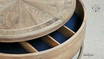 Detailed view of the coffee table's rotating top in mid-rotation, showcasing functionality.