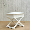 Close-up of the table’s legs, featuring unique cross-beam detailing for a timeless look.